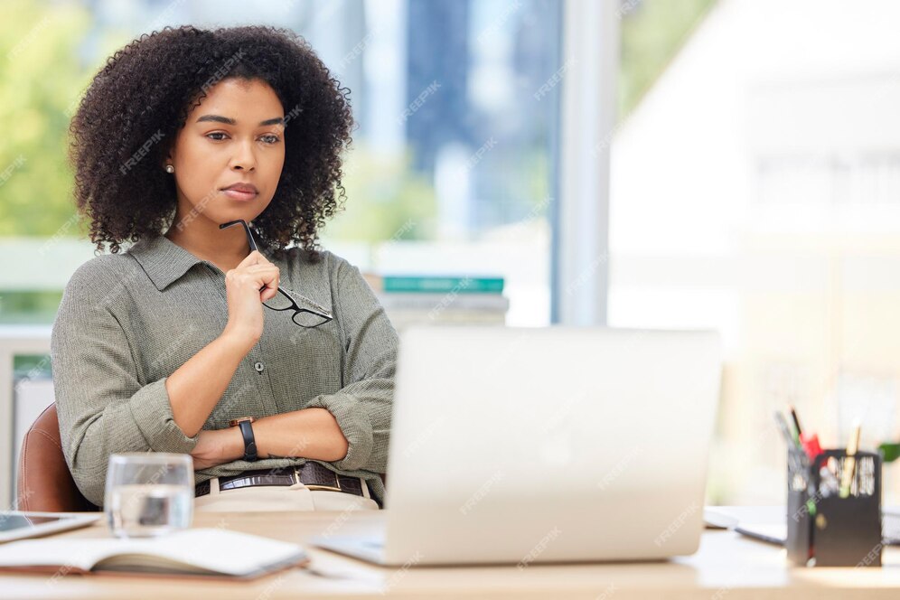 South African entrepreneur working on a laptop at a desk, researching company formation with CIPC.